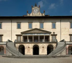 a frieze adorning the facade of the villa at Poggio a Caiano, below clock and bell