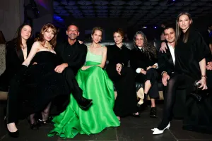 guests seated for photo dressed in formal wear